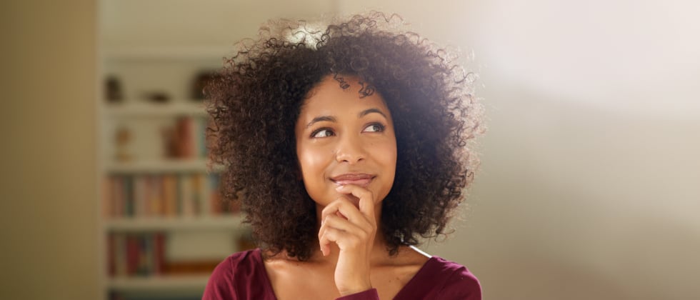 A woman who looks like she's thinking about something