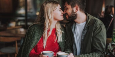 A couple looking lovingly at each other with their noses touching